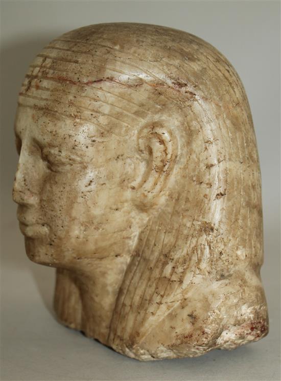 An Egyptian quartzite bust of a man, late period (26th dynasty), possibly a priest, height 17cm